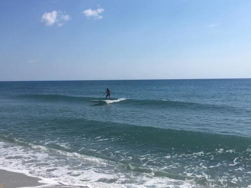Person in SUP at the sea in Posada
