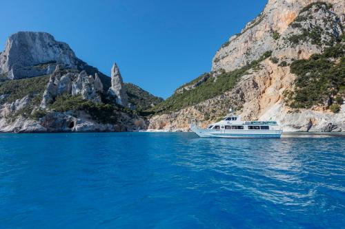 Motor ship in front of Cala Goloritzè