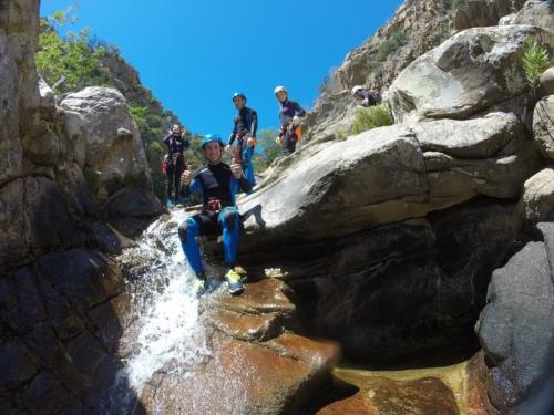 Hikers during the descent from a waterfall