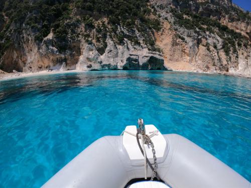 Inflatable boat in the Gulf of Orosei and crystal clear sea