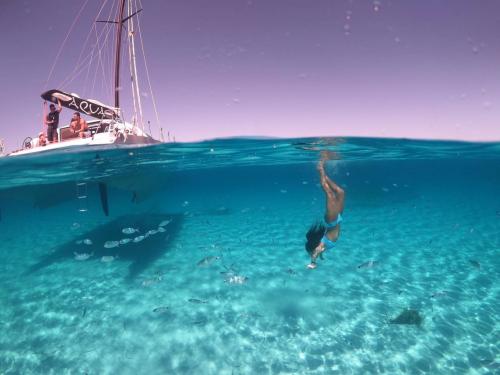 Girl snorkels in transparent waters