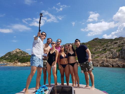 Group of hikers aboard a boat during a day tour