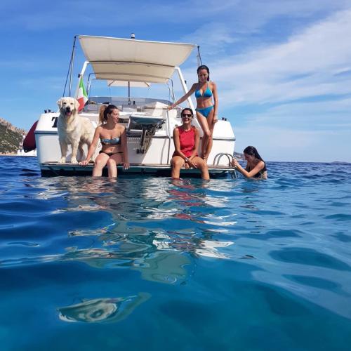 Passengers relax on board a boat during an excursion to Tavolara