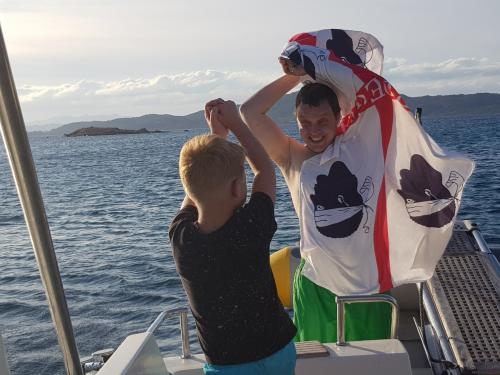 Passengers relax on board a boat during an excursion to Tavolara