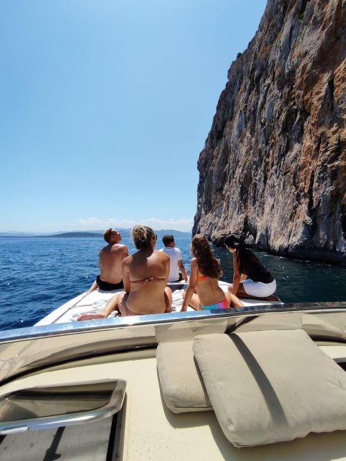 Passengers relax on board a boat during an excursion to Tavolara