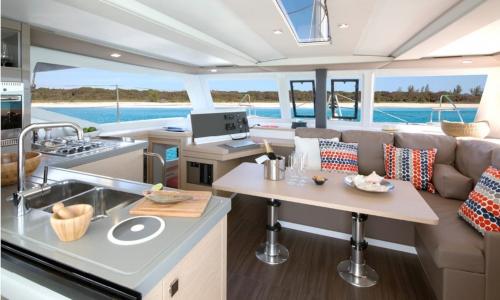 Cabin of a luxury catamaran with kitchen with sea view