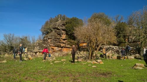 remains of nuraghe in Bolotana and statue of the madonna