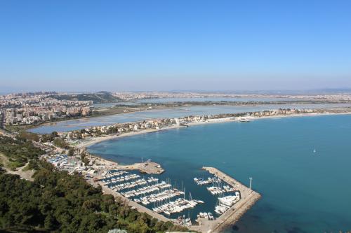 panoramic view of the Gulf of Angels from the Sella del Diavolo (Devil's Saddle)