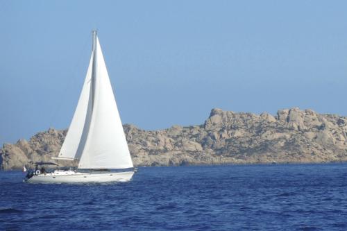 Sailboat during weekly charter in northern Sardinia