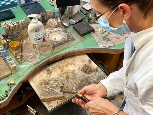 goldsmith handcrafts Sardinian silver to create a jewel