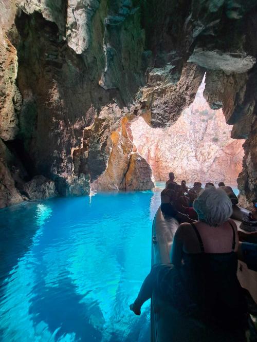 Hikers inside the Sardinia Cave in Masua