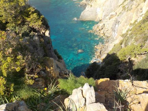 Trekking route overlooking the crystal clear sea