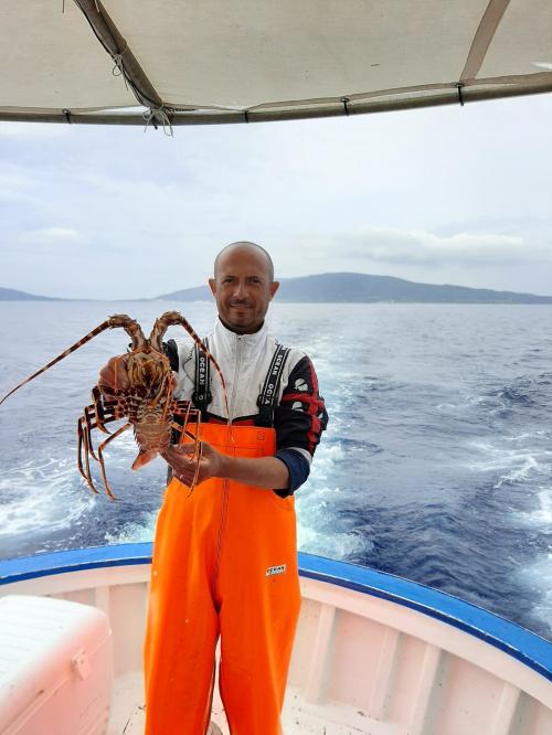 Captain with freshly caught lobster