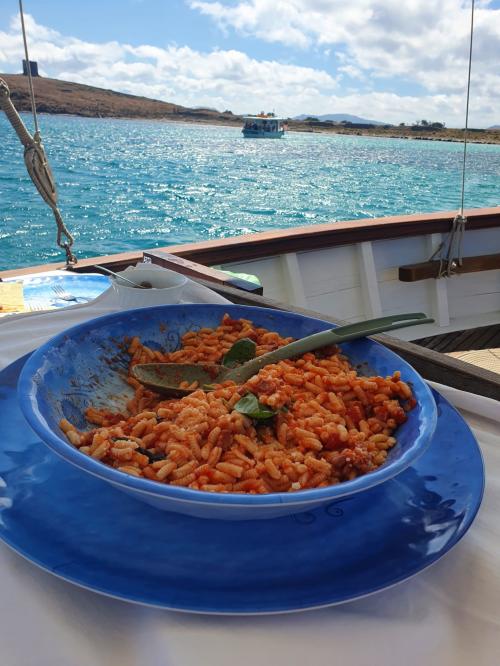 Pasta served aboard a vintage sailing ship