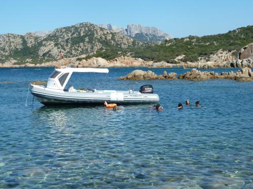 Dinghy and tourists in Tavolara