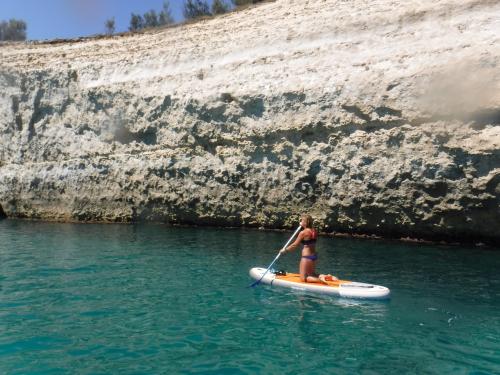 Girl during SUP excursion in Balai