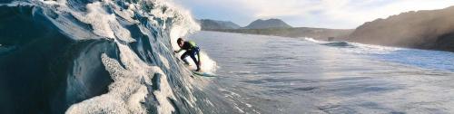Boy surfing in Buggerru