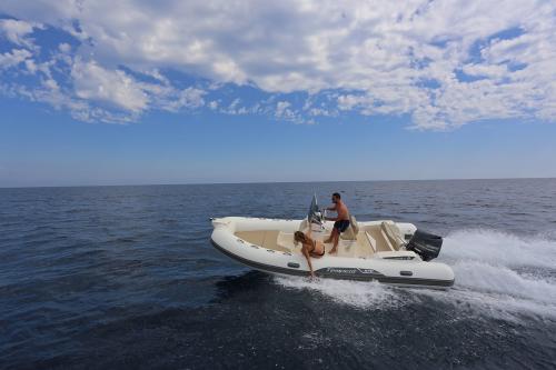 Boy and girl in rubber dinghy