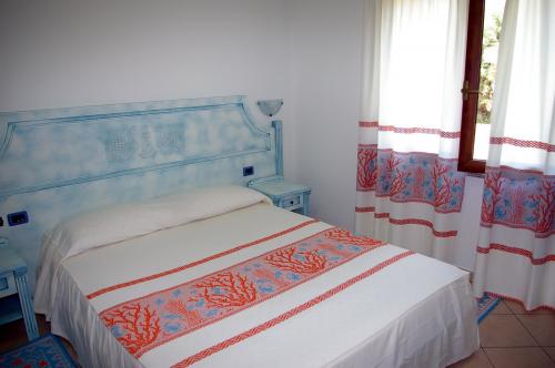 Double bed room of a Residence in Arbatax