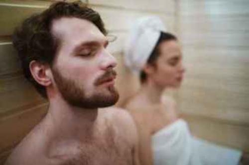 Couple relaxes in the sauna