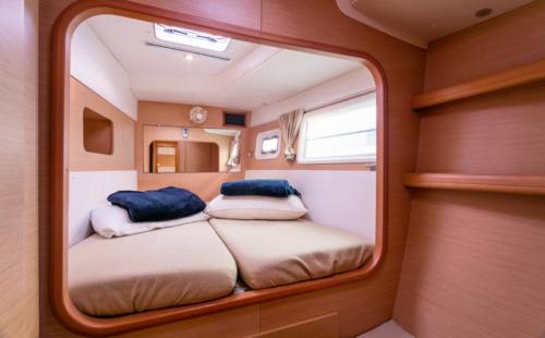 Bedroom of a catamaran in the waters of the La Maddalena Archipelago