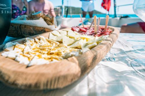 Aperitif on a platter on a sailing boat in Asinara
