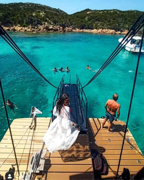 Hikers dive from the boat