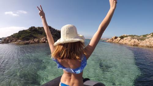 Girl aboard an inflatable boat in La Maddalena Archipel