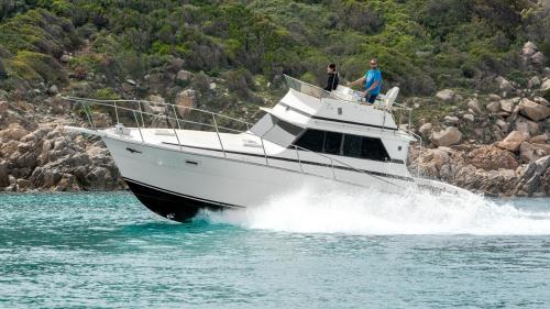 Motor boat sails in the sea of La Maddalena Archipelago